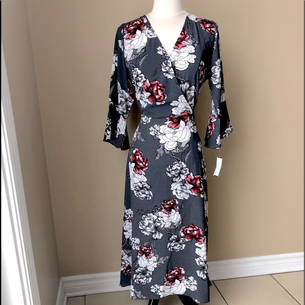 New with tags. Beautiful, elegant deep grey, floral wrap style flowing dress.